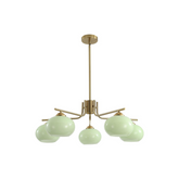 Chandelier with gold frame and green glass shades on a white background
